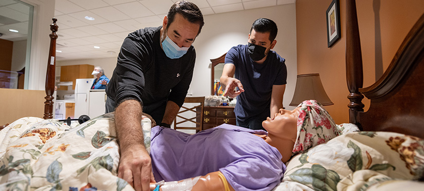 School of Nursing staff prepare a simulation suite for education