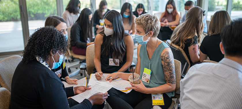 Students in the poverty simulation learn about making health decisions on limited incomes.