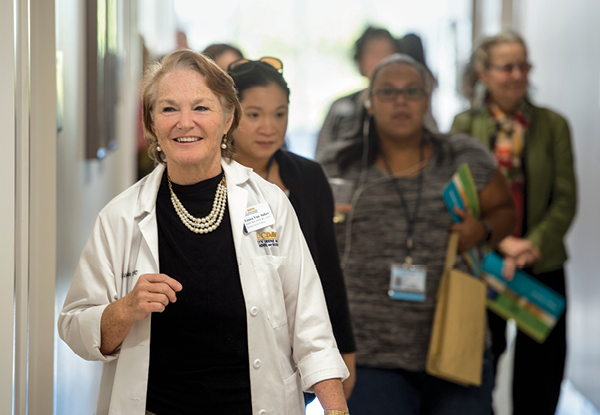 Assistant Clinical Professor Laura Van Auker guides guests through the primary care simulation suite.