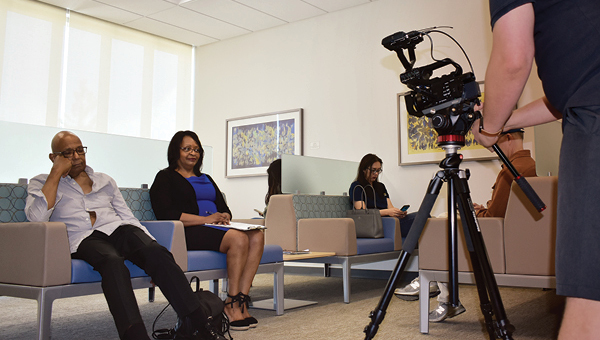 The family caregiving program uses videos to demonstrate complex situations, such as clinic visits. In this video, a woman and her father sit in a clinic waiting room. The viewers hear each person’s thoughts in order to gain a better sense of the stressful situation for both.