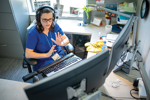 Jessica Draughon Moret, the assistant director for the Master's Entry Program in Nursing, juggles remote learning with small-group, in-person simulation learning.
