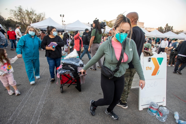 Wildfire distribution center with people picking up essential daily items