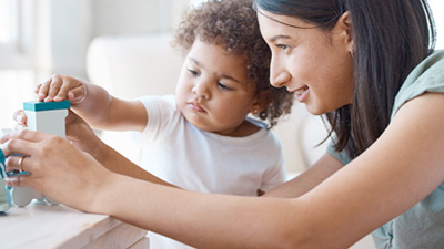 Woman playing with child