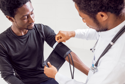 Male doctor conducts exam on male patient. (c) UC Davis Regents. All rights reserved.