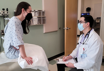 Student with standardized patient. (c) UC Davis Regents. All rights reserved.