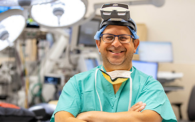 Spine surgeon wearing augmented reality glasses