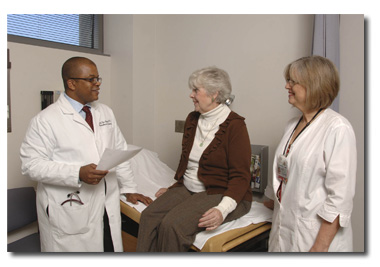 David T. Cooke, thoracic surgeon, talking to a patient