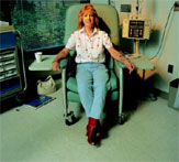 PHOTO -- Judy Butts, a melanoma patient, receives an investigational chemotherapy treatment through a clinical trial refereed by biostatisticians