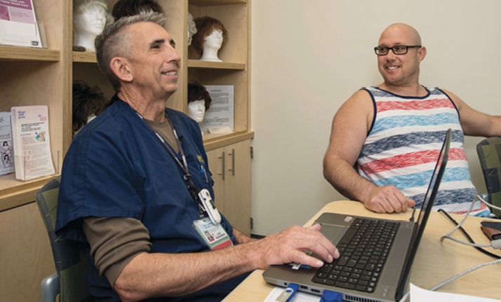 Dale Johnson teaches Jason Mitchell about what to expect during chemotherapy treatment.