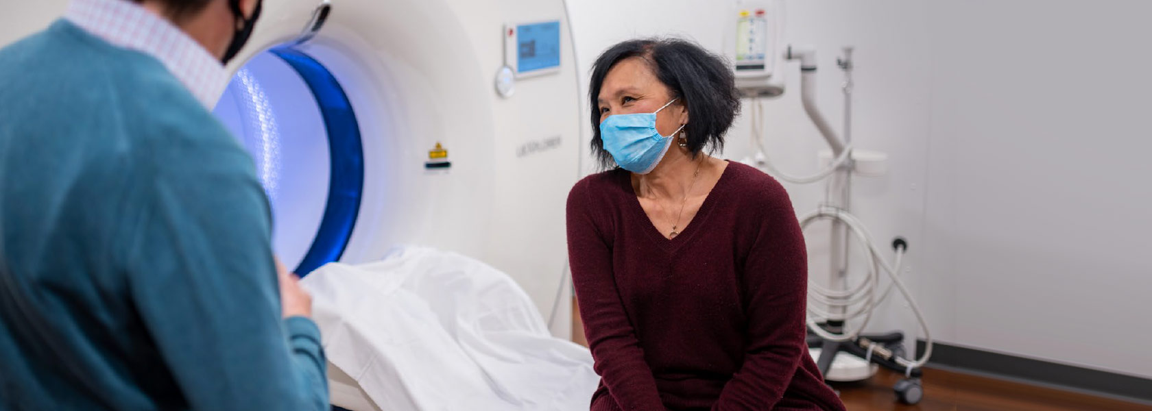 woman speaking to doctor while sitting on EXPLORER