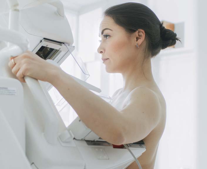 Asian woman having a mammogram