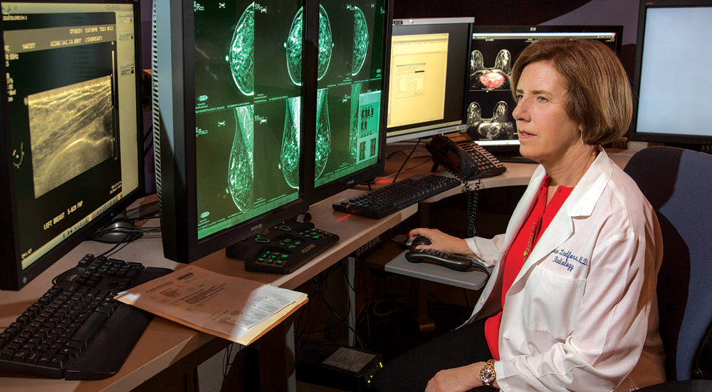 Karen Lindfors, loooking at a mammogram scan