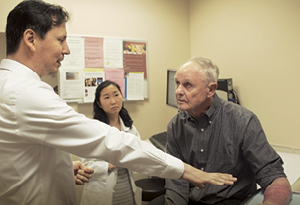 Dr. Maverakis with Larry Moberg at the end of his melanoma treatment.