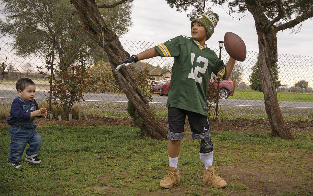 Jorge throwing a football