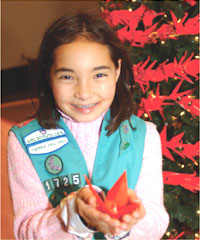 PHOTO — Olivia Bowman, member of Junior Girl Scouts Troop #1725, displays one crane.