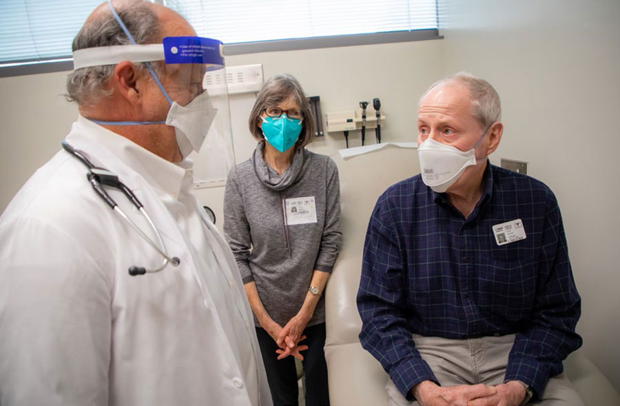 Alan and Ann Gains getting good news from oncologist Joseph Tuscano that the CAR T cell-therapy worked.