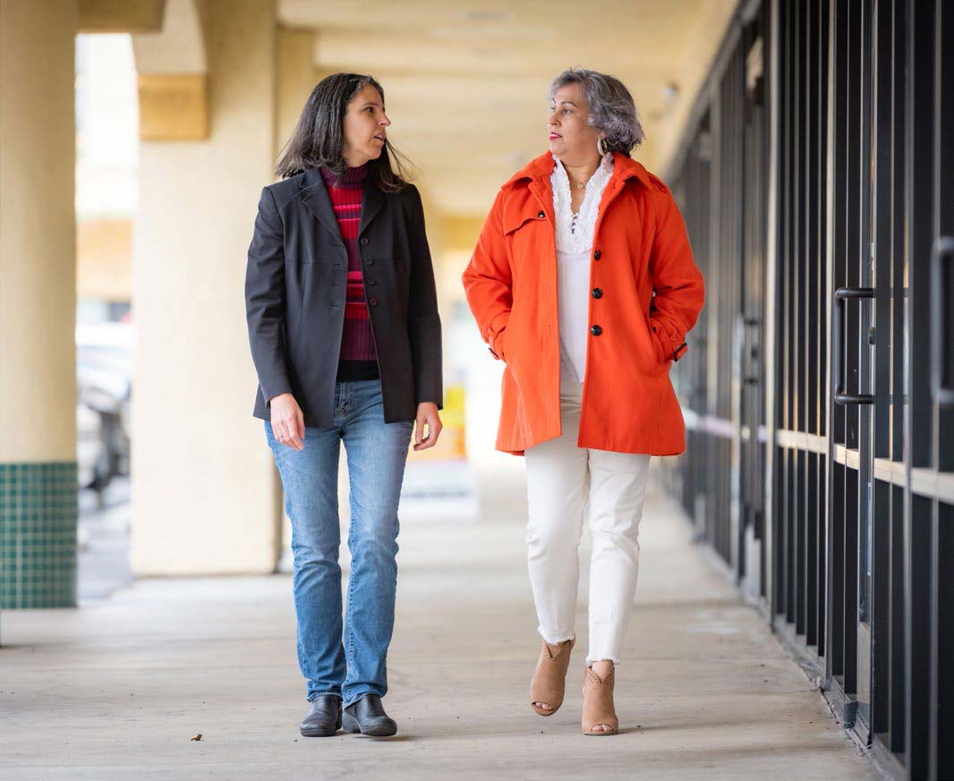 Co-director of the new Women’s Cancer Care and Research Program (WeCARE) Laura Fejerman meets with promotora Maria Gonzalez in south Sacramento.