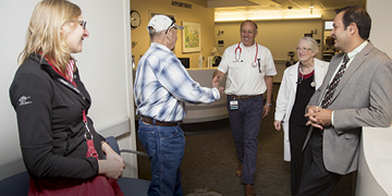 Donor Diana von der Heyde and recipient Rick Little visit with Little’s oncologists, Joseph Tuscano, Carol Richman and Mehrdad Abedi.