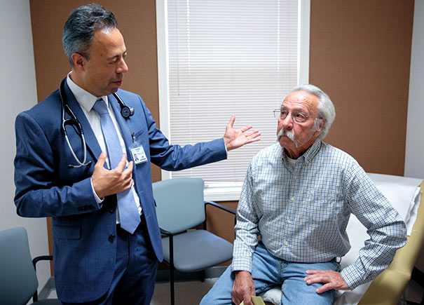 oncologist Sam Mazj with patient Butch Bromley