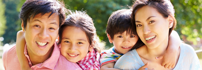 Smiling children with adults (c) UC Regents. All rights reserved.